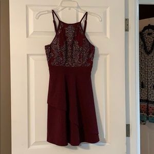 Burgundy knees length dress.